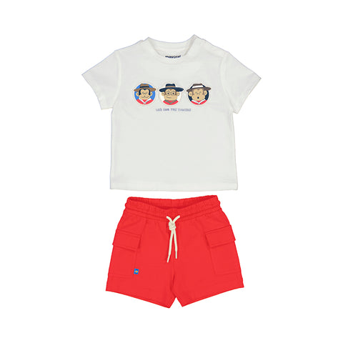 white shirt with monkeys paired with red shorts