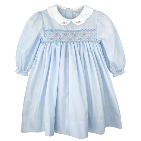 long sleeve baby blue smocked dress with pink rosettes on the smocking and collar