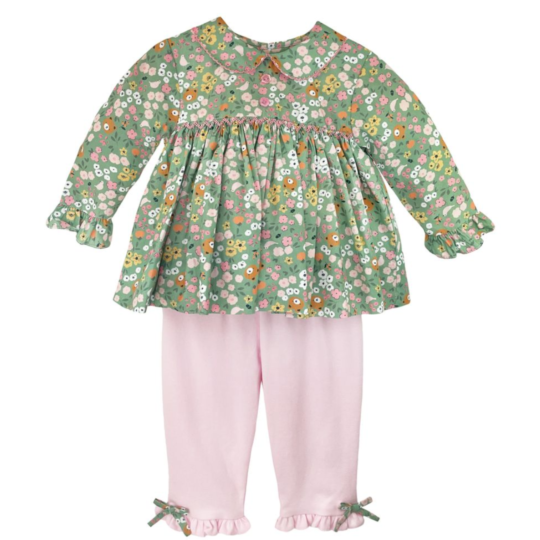 green floral print with little bear heads and a solid pink knit pant with matching bows at the ankle