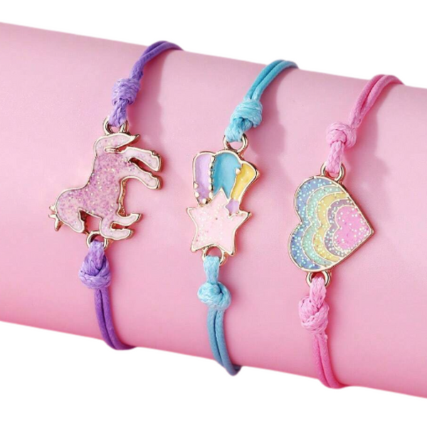 3 pc set of adjustable rope bracelets each with a different charm, horse, rainbow heart and rainbow star
