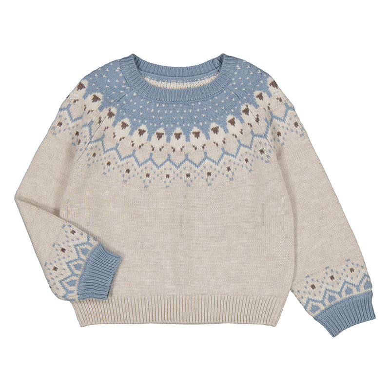 cream and light blue sweater with a geometric  and heart print at the neck and sleeve