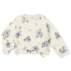 cream pullover with blue and brown flower detail