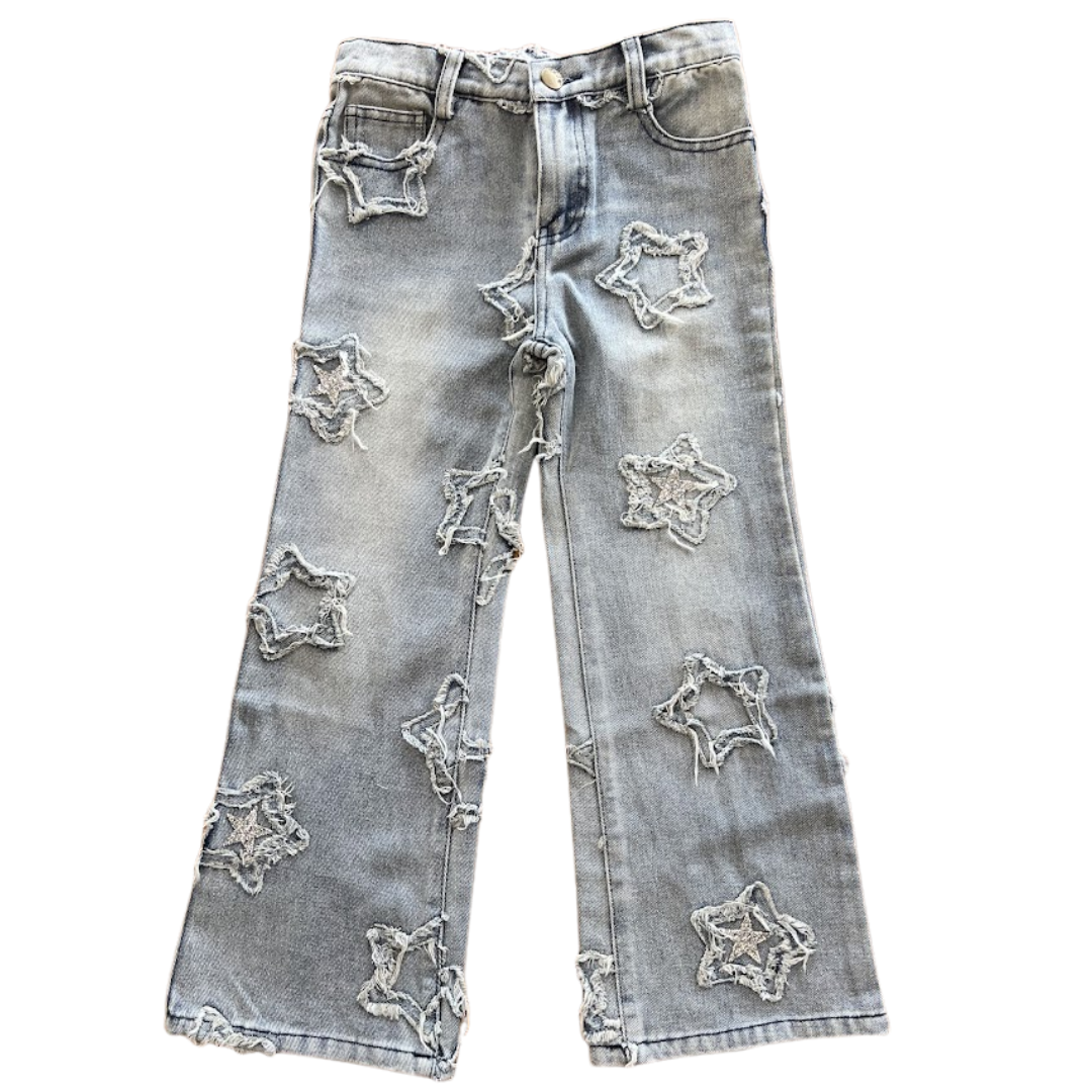 Light wash jeans with frayed star applique with same fabric and silver sequin stars placed sporadically