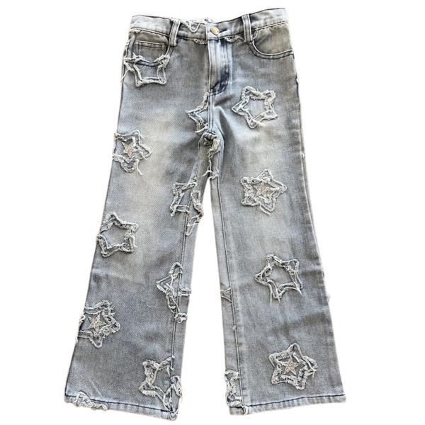 Light wash jeans with frayed star applique with same fabric and silver sequin stars placed sporadically