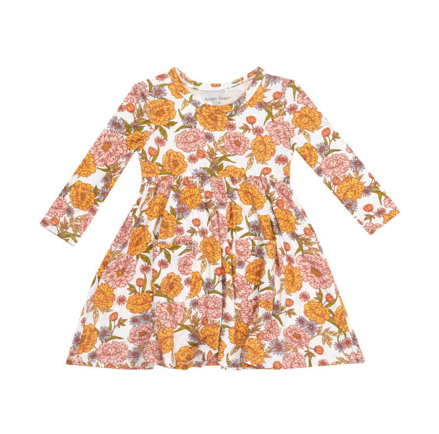 white twirly dress with orange and pink flowers