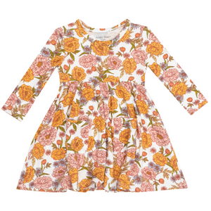 white twirly dress with orange and pink flowers