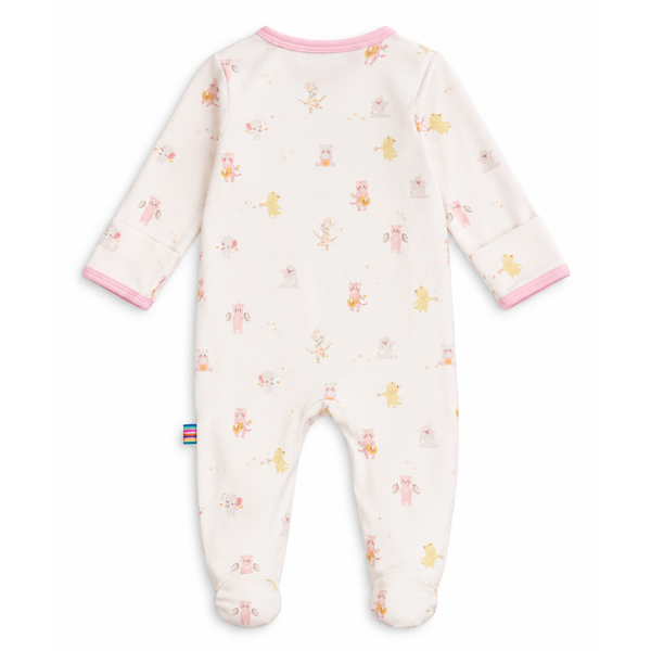 A baby onesie with animals playing instruments with a light pink background. 