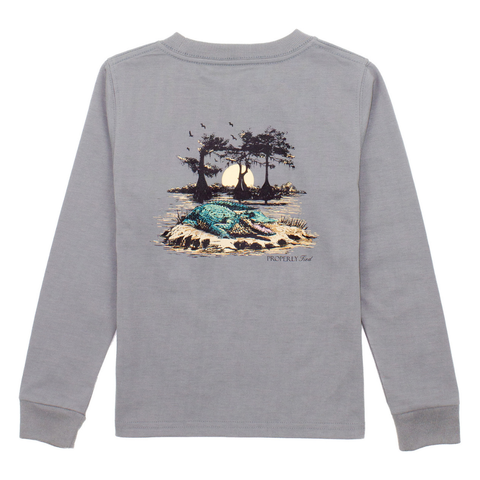 Boys’ grey long sleeve shirt with graphic of an alligator in a bayou at sunset with trees and birds

