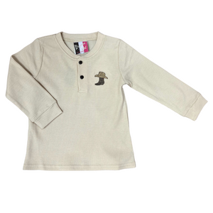 beige waffle knit henley style long sleeve tee.  Accented with 2 front buttons and an embroidery of a cowboy boot and hat
