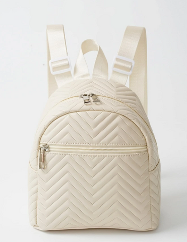 Tween, beige backpack with a chevron pattern. 