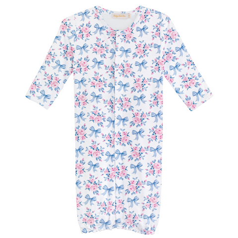 White baby gown with allover pink floral and blue bow print, featuring long sleeves and elastic bottom for easy diaper access.