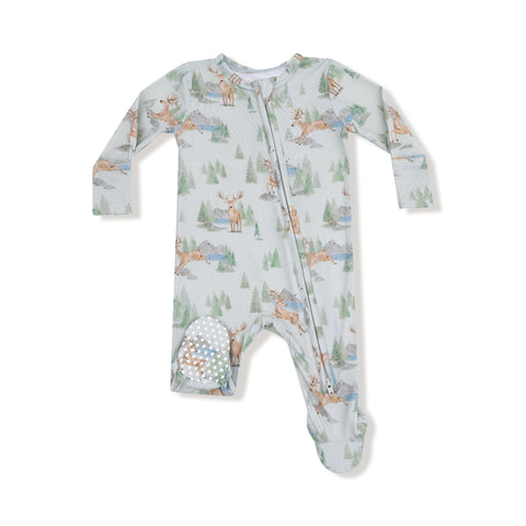 Front view of baby footie with watercolor buck deer and tree print, featuring zipper closure and grippy footies

