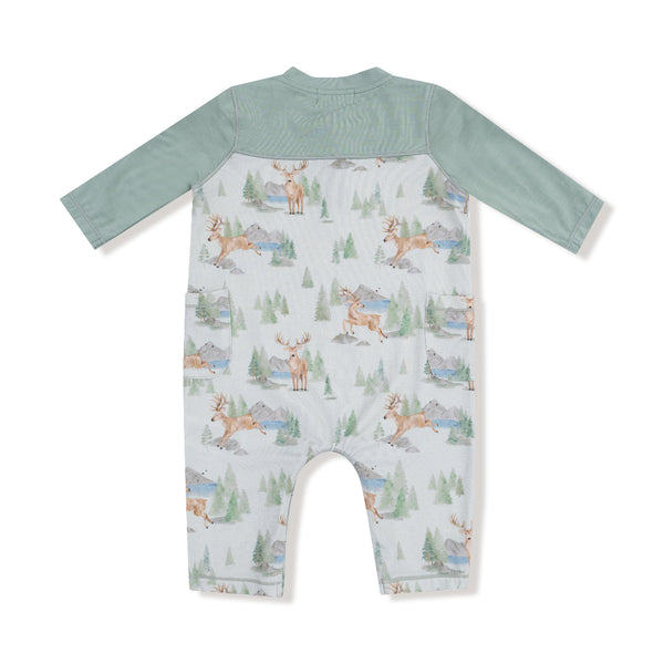 Back view of woodland-themed romper with forest animals and patch pockets

