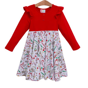 long sleeve christmas dress with ruffles at the shoulders on a solid red bodice and a printed candy twirl skirt