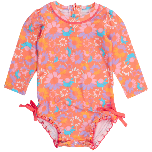 Long-sleeve baby swimsuit in bright floral print with bow side ties and ruffle trim, featuring UPF protection.
