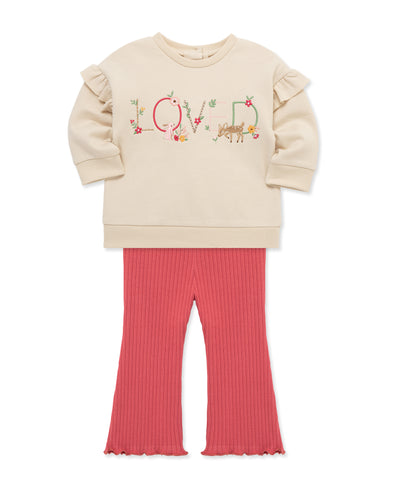 cream sweatshirt with "loved" stitched on the front with matching pink pants