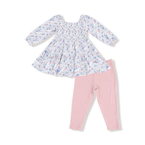 Baby girl's floral long sleeve smocked dress with pink bamboo leggings, laid flat on a white background.

