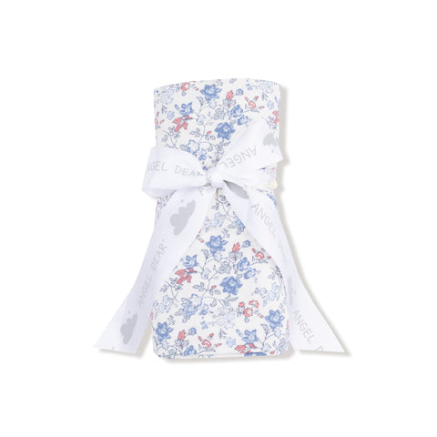 Country floral swaddle blanket with vintage-style blue and pink flower print on white background, partially rolled. 









