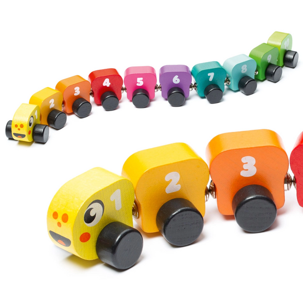 Wooden rainbow caterpillar toy laid out in numbered order with 10 bright magnetic segments and smiling face