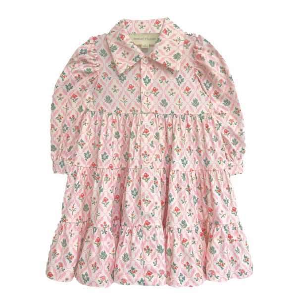 Front view of a pink floral girls' dress with long puff sleeves, ruffle collar, and button-up front, displayed flat.
