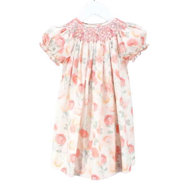 Front view of a girl's dress with fall-toned watercolor floral print and smocked neckline
