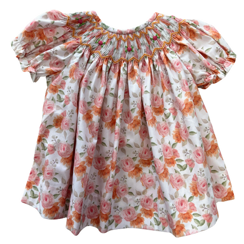 Rose floral print smocked bishop, short sleeves in shades of pink, soft orange and green.  Perfect fall dress
