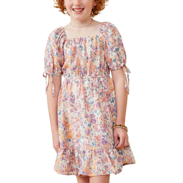 Girl in fall floral print dress with square neckline and puff sleeves