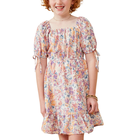 Girl in fall floral print dress with square neckline and puff sleeves