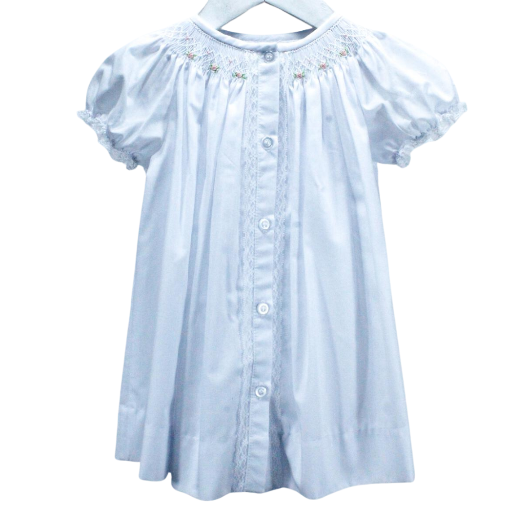 traditional style day dress for girl in white. Lace touches at the button placket and sleeve with bullion roses smocked at the neckline