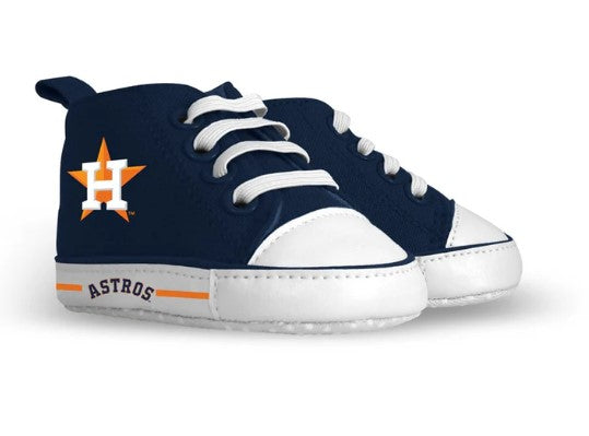 soft baby shoes in navy with white sole and accents with the Houston Astro's logo on the side of the shoe and Astros written on the side of the sole.