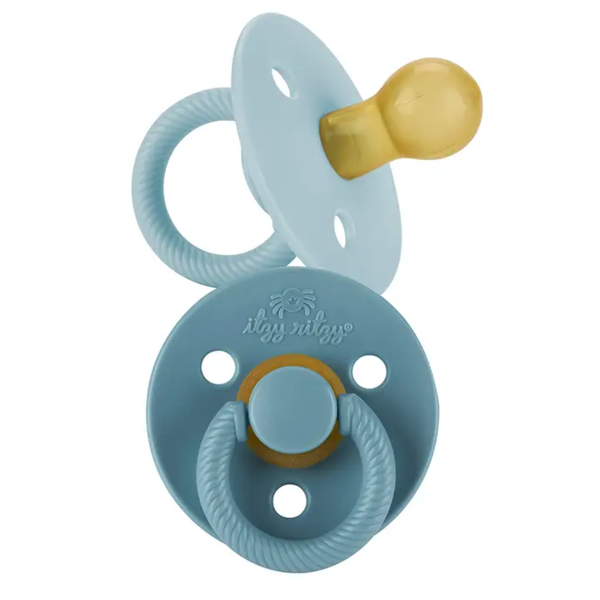Itzy Ritzy soother pacifier in blue Harbor and Coast shades with natural rubber nipple and textured ring handle.