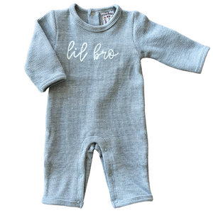 long sleeve light blue heathered knit baby romper with "lil bro" chain stitch embroidery in white on the front