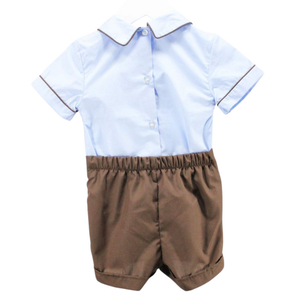 Back of the outfit showing button closure on the shirt and elastic waistband on shorts