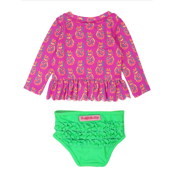 pink long sleeve rash guard with neon pineapples and matching green bottoms