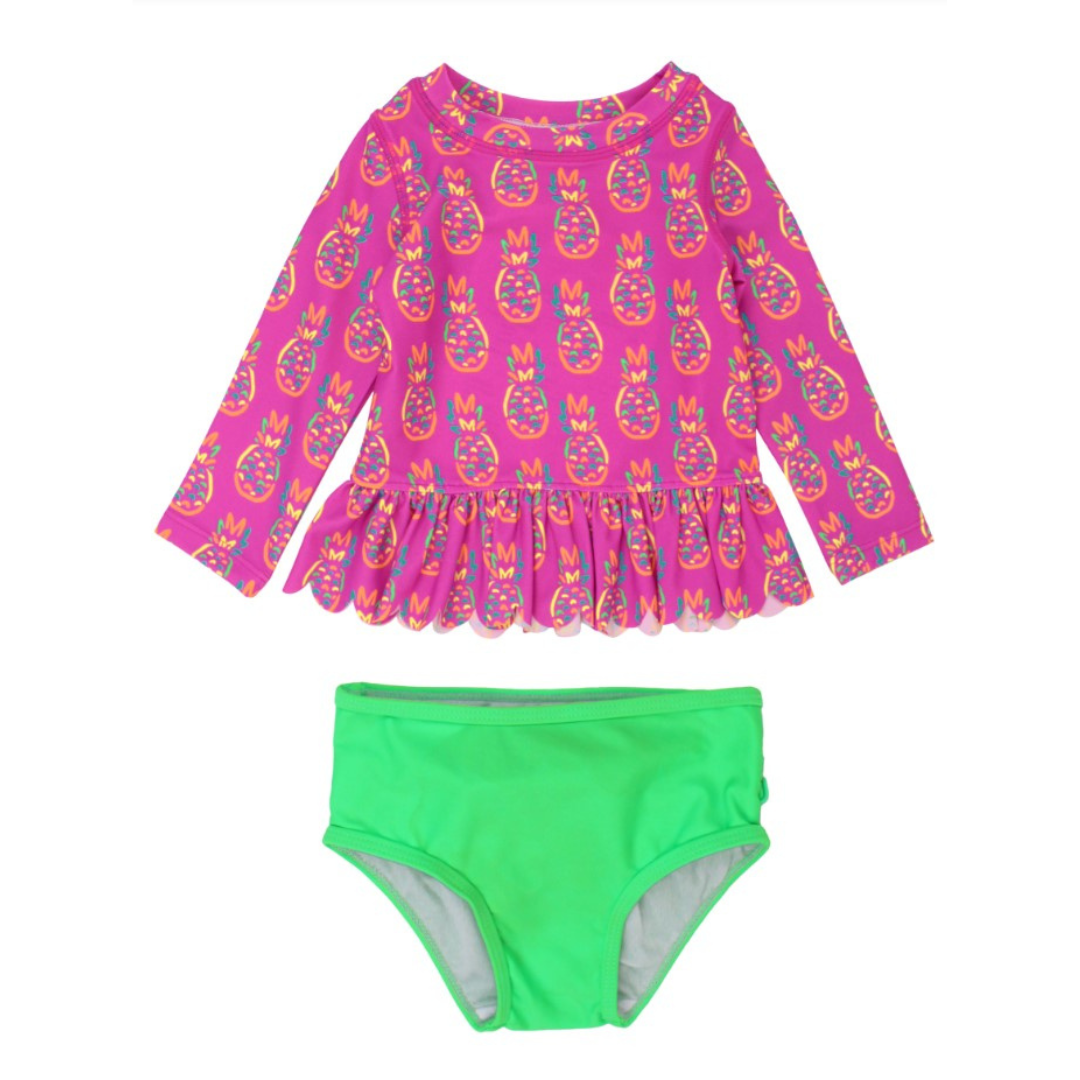 pink long sleeve rash guard with neon pineapples and matching green bottoms