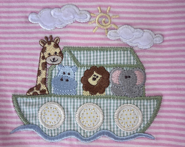 closeup of noah's ark applique giraffe, hippo, lion and elephant in the ark
