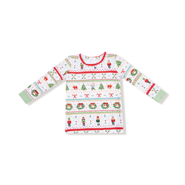 Front view of holiday pajama top with festive nutcracker print and green cuffs