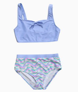 solid periwinkle tank style top with front bow and printed bottoms with pastel wave print with daisies
