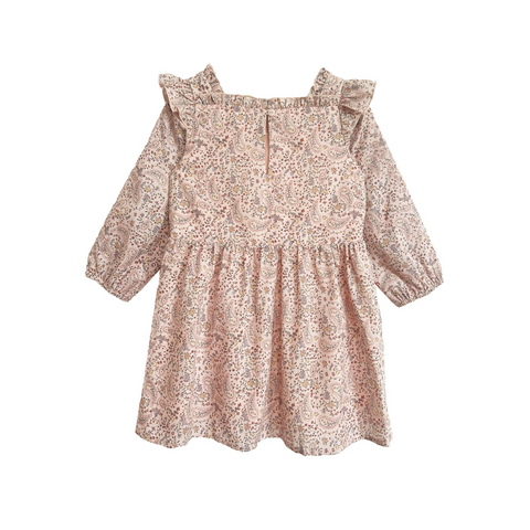 Back view of a girls’ long sleeve dress with a pink paisley floral print and ruffled shoulders, featuring a keyhole button closure.
