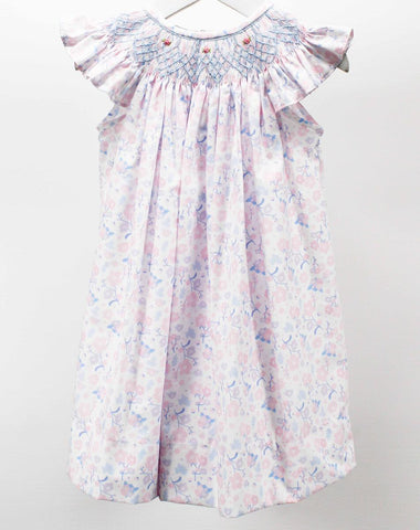 Girl's angel wing bishop in a pastel blue and pink floral print with blue smocking and pink roses.