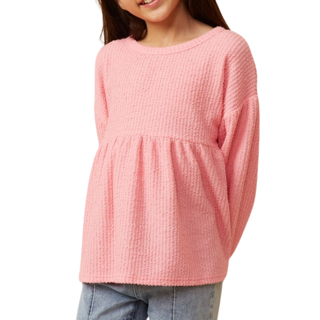 pink textured peplum style long sleeve top for girls.  Empire waist with gathers.