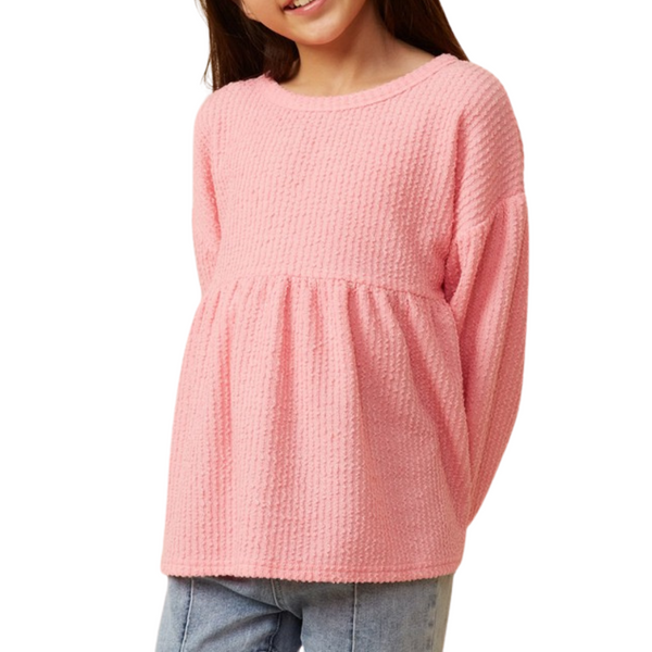 pink textured peplum style long sleeve top for girls.  Empire waist with gathers.