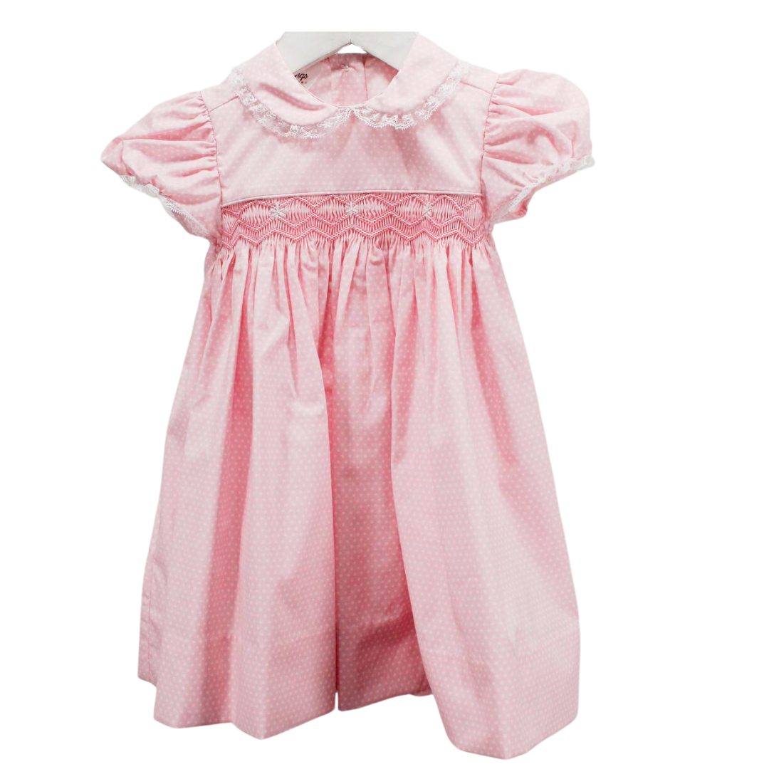 Traditional style empire waist smocked bodice dress in a soft small pink and white dot fabric and lace trimmed collar and short sleeves