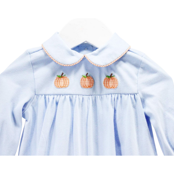 Close up of the stitched pumpkins and collar. 