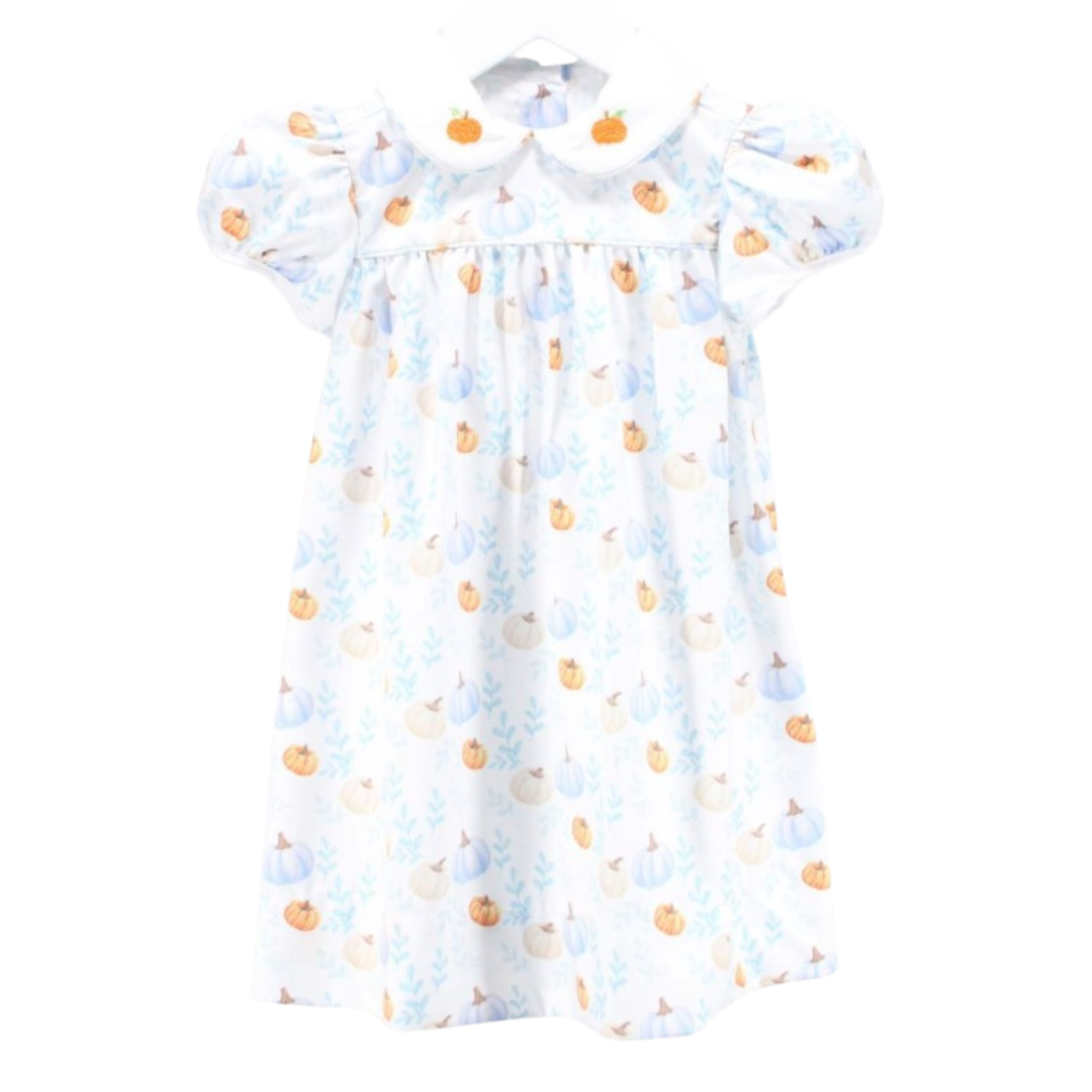 Front view of a girl's fall dress with puff sleeves and an all-over pumpkin and leaf print, featuring a white Peter Pan collar with embroidered pumpkins.