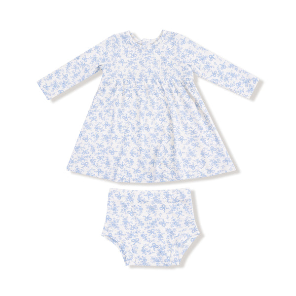 A baby girl's long-sleeve dress in a white and soft blue floral bow print, paired with a matching bloomer. Made of lightweight ribbed cotton.