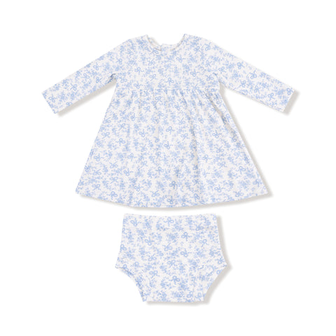 A baby girl's long-sleeve dress in a white and soft blue floral bow print, paired with a matching bloomer. Made of lightweight ribbed cotton.