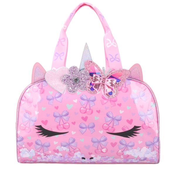 Pink unicorn duffle bag with bow and cherry print, glitter accents, and confetti bottom detail