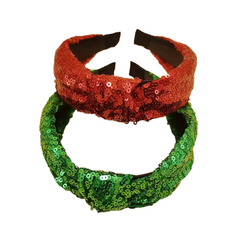 Two sequined knotted headbands, stacked one on top of the other. The top headband is bright red, and the bottom headband is vibrant green.