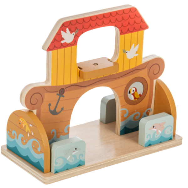 Side view of wooden Noah’s Ark with a red roof, dove illustrations, an anchor, blue waves, and sea animal designs.